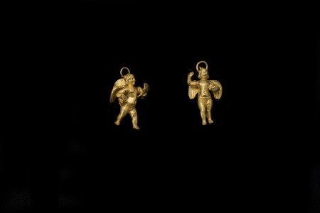 Two gold eroses figures